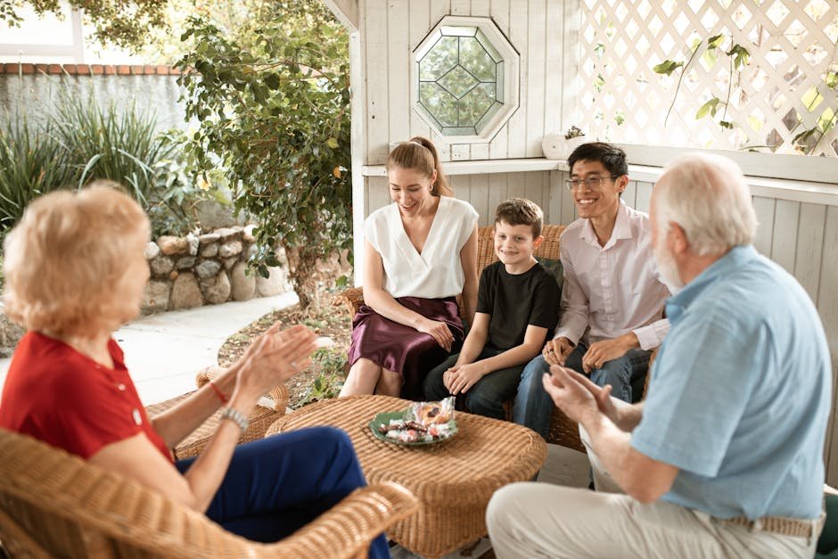 A diverse family enjoys a cheerful gathering in a cozy patio setting.